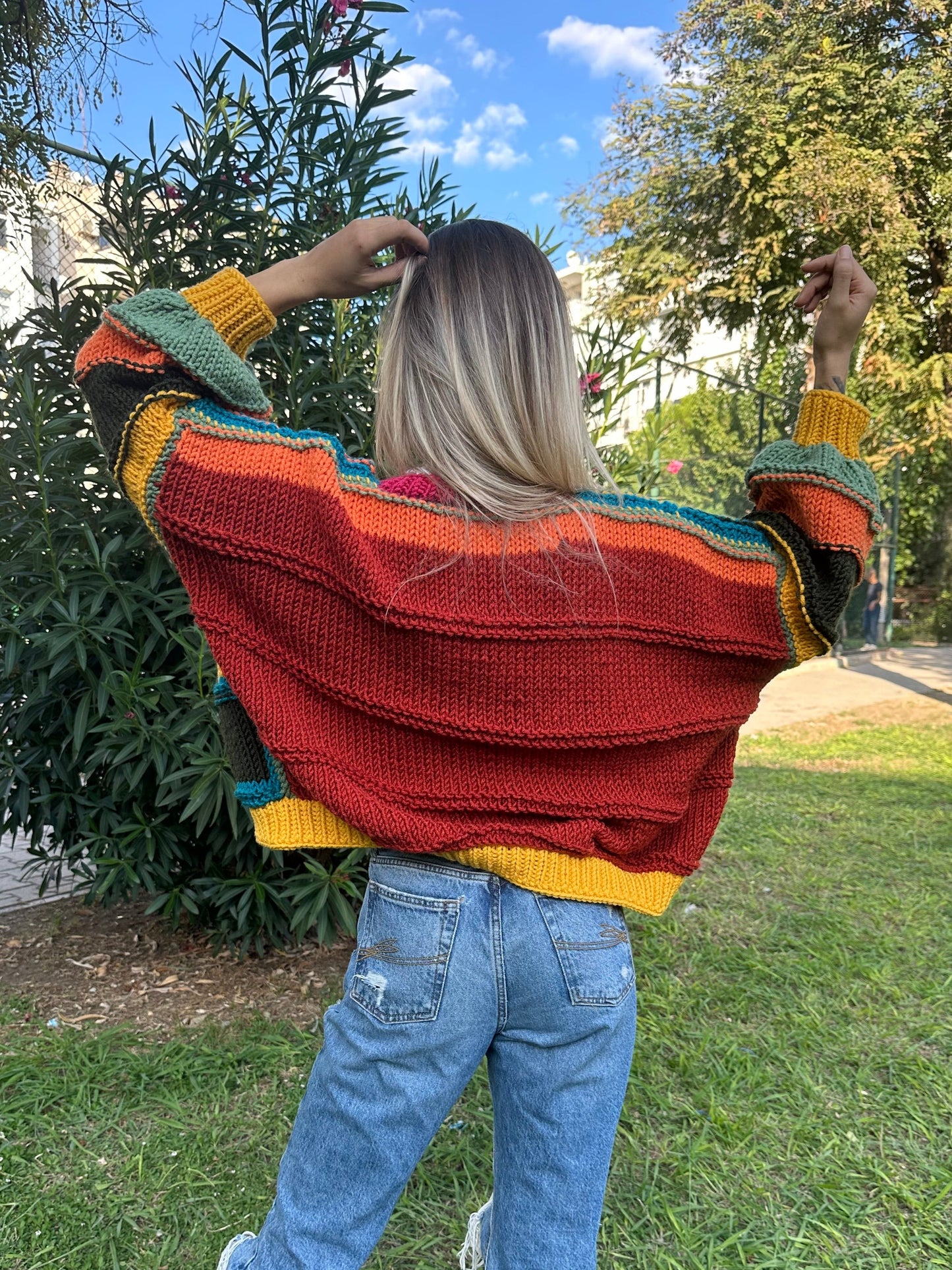 patchwork cardigan, cozy knitwear, colorful cardigan, soft yarn sweater, relaxed fit style, vibrant statement piece, must-have layering item, handmade charm, bold color combination, trendy fall fashion